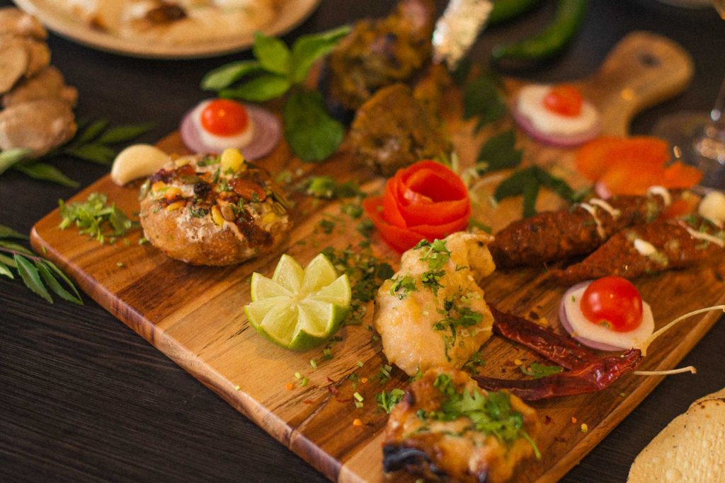 Plate of Indian appetisers platter with garnishes | Indian Starters | Indian Appetisers | Kings XI